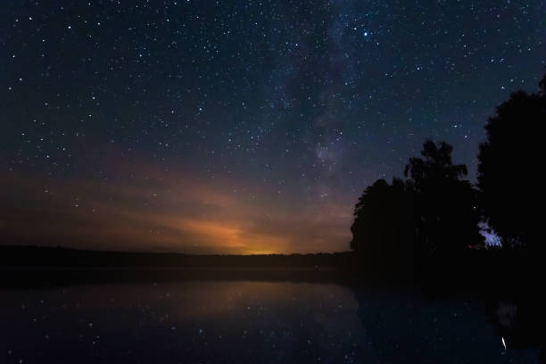istock Starry sky, milky way, beautiful landscape, night time, Belarus. 1091475580