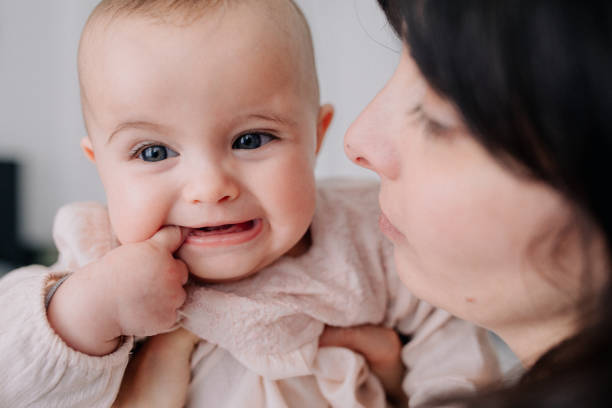 istock Mother cuddling with her baby daughter 1091478076