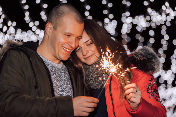 istock Young happy couple having fun with sparklers 1091482692