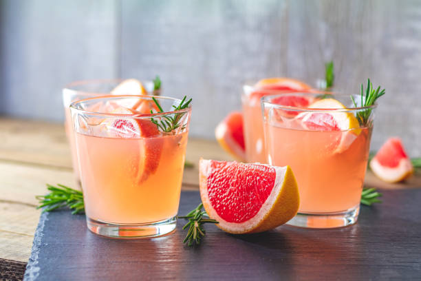 istock Fresh pink alcoholic cocktail with grapefruit, ice and rosemary 1091482880