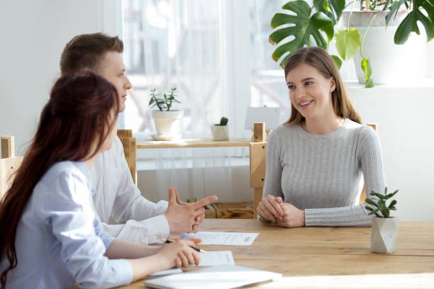 istock Confident female applicant talk at interview with recruiters 1091483434