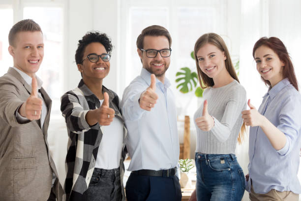istock Happy millennial people standing showing thumbs up 1091483476