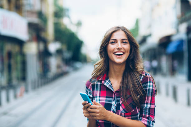 istock Happy woman using smart phone 1091485162