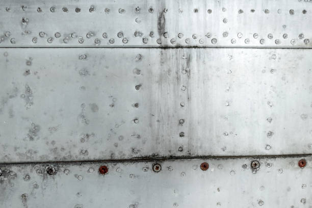 istock Texture, Aluminum fuselage and rivets on an old plane. Old technologies. copy space 1091485326