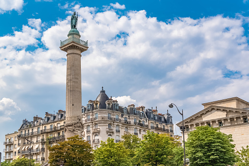 Paris, place de la Nation, typical buildings and the column and statue