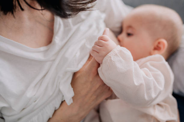 istock Mother breastfeeding her baby daughter 1091486216