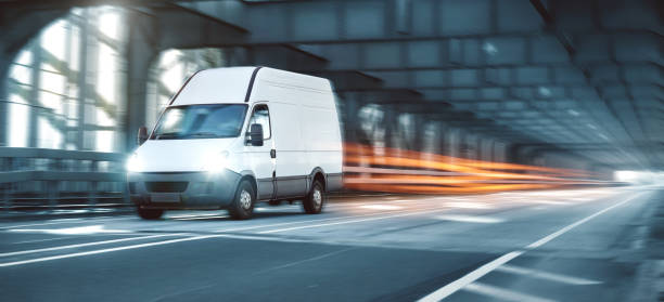 istock Van driving on a road through an industrial style bridge 1091488740