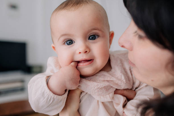 istock Mother cuddling with her baby daughter 1091488796