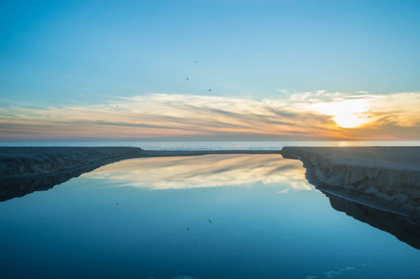 istock Moody sunset over Santa Monica beach with reflection off water 1091489668