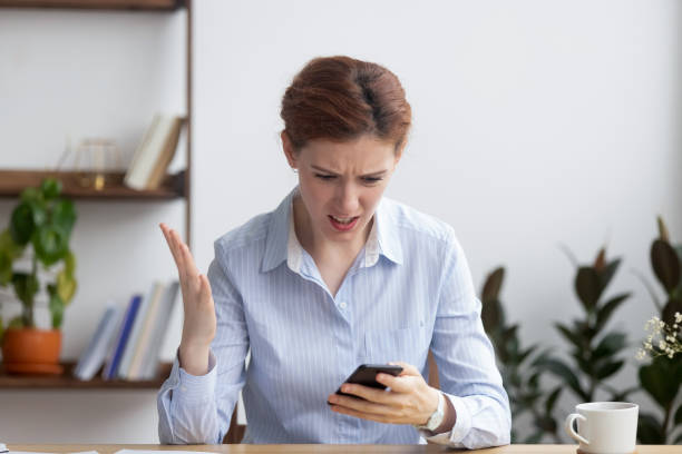 istock Female feels irritation about discharged or broken mobile phone 1091491658