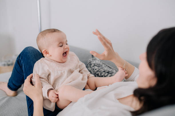 istock Mother cuddling with her baby daughter 1091491722