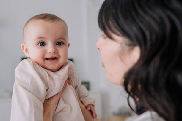 istock Mother cuddling with her baby daughter 1091491878