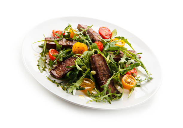 istock Grilled beef steak and vegetables on white background 1091492046