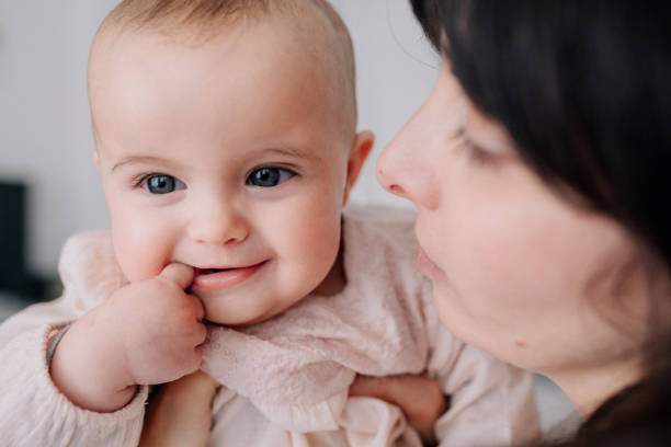 istock Mother cuddling with her baby daughter 1091494716