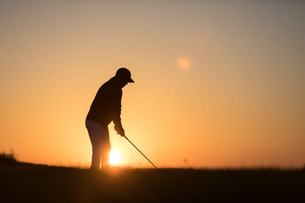 istock Golf player shoting ball -  Links Golf - Sunset Time 1091495348