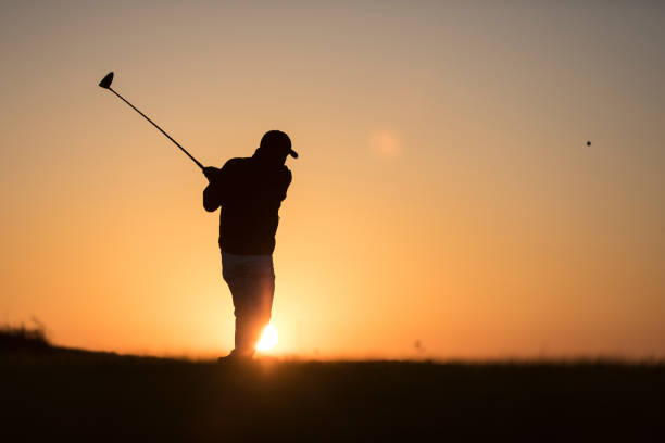 istock Golf player shoting ball -  Links Golf - Sunset Time 1091497068