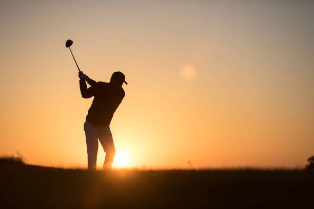 istock Golf player shoting ball -  Links Golf - Sunset Time 1091498408