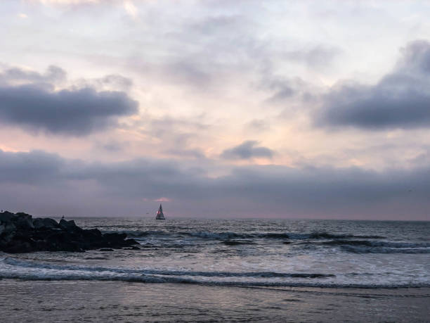 istock Sun sets over Venice Beach, CA with moody sky 1091498576