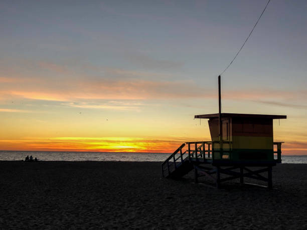 istock Sun sets over Venice Beach, CA with moody sky at Pride Lifeguard tower 1091498916