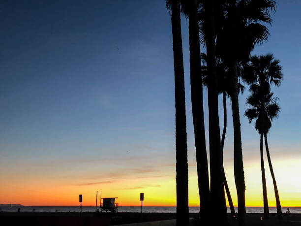 istock Sun sets over Venice Beach, CA with moody sky at Pride Lifeguard tower 1091498972