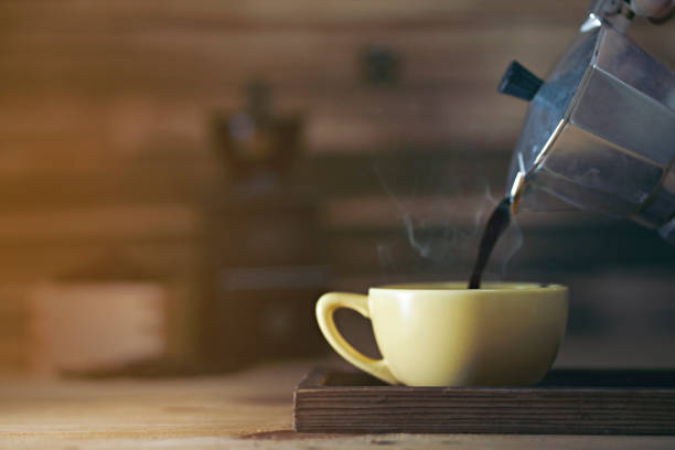 istock pouring coffee and coffee cup 1091505918