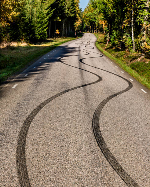 Skid marks Skid marks in wave pattern on a small country road street skid marks stock pictures, royalty-free photos & images