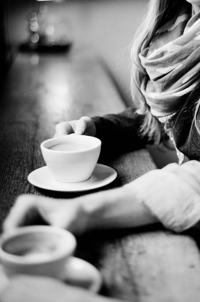 istock closeup of coffee cups two people sitting at table 1091508140