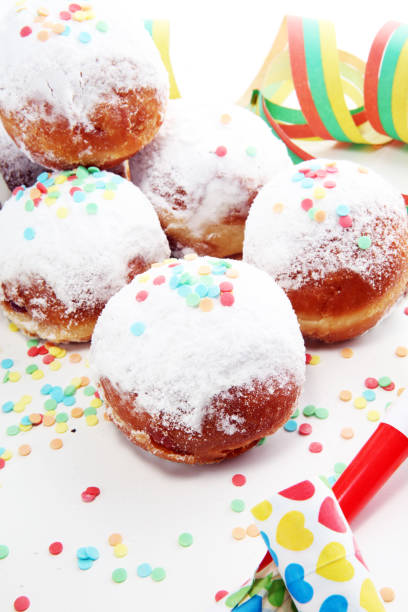istock German donuts with jam and icing sugar. Carnival powdered sugar raised donuts 1091516712