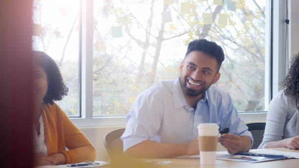 istock Cheerful manager facilitating meeting 1091518752