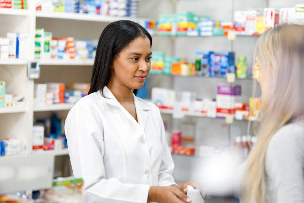 istock Woman pharmacist attending client 1091518922