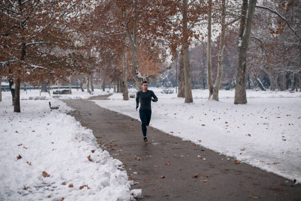 istock Young man exercising on winter day 1091526548