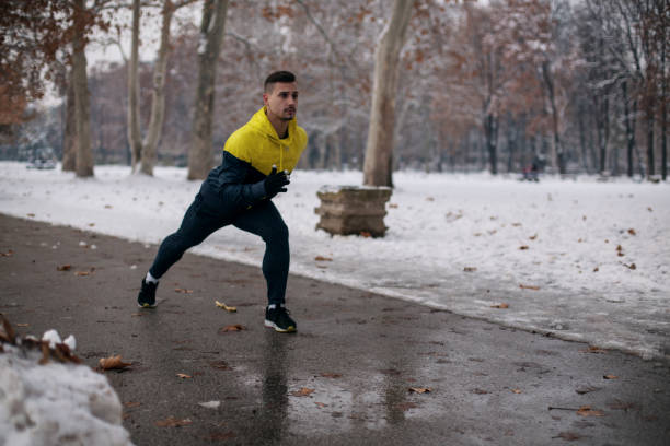 istock Young man exercising on winter day 1091526658