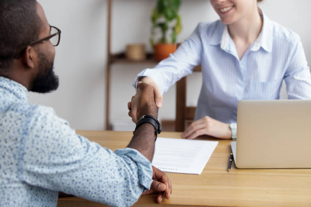 istock Diverse business people shaking hands greeting each other 1091526920