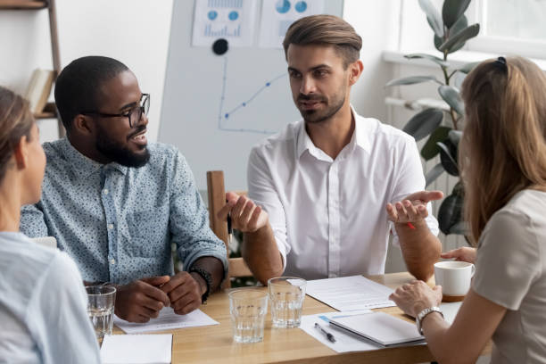 istock Diverse colleagues discussing during meeting in office 1091527042