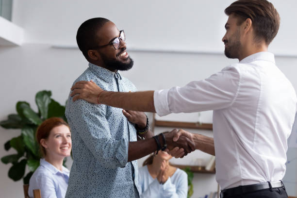 istock Company boss congratulating handshaking with successful employee 1091527056