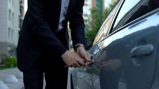 istock Tired business person locking car with keys, returning home from work, busy man 1091529668