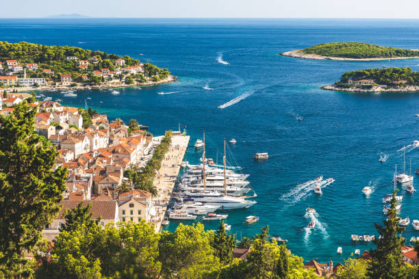 Beautiful island and town of Hvar, Croatia Beautiful old town of Hvar looking at the pier and bay of water of the Adriatic Sea hvar photos stock pictures, royalty-free photos & images