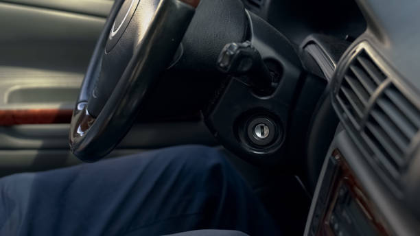istock Man sitting inside modern car, transmission steering wheel and dashboard closeup 1091532068