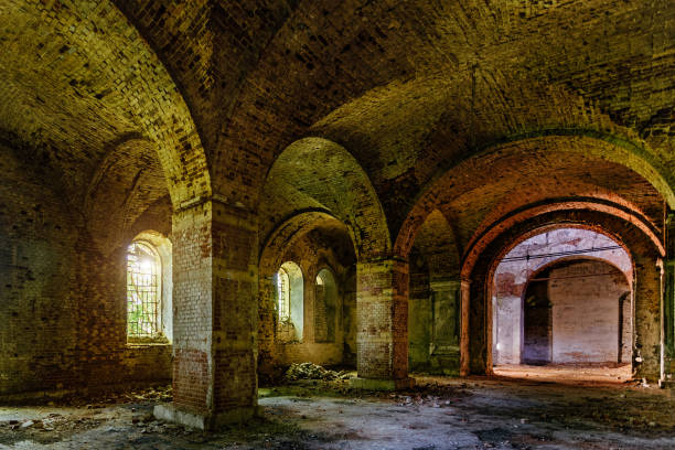 istock Large ancient vaulted hall of abandoned building 1091534942
