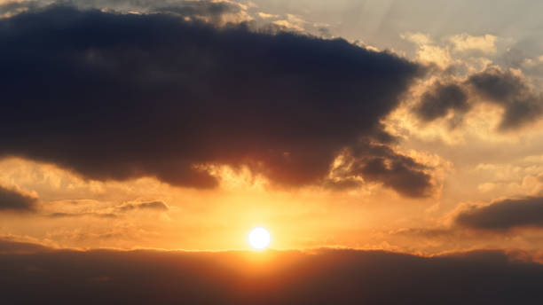 istock Bright big sun on the sky with yellow orange gradient colors, beautiful sunset cloudy sky. 1091537086