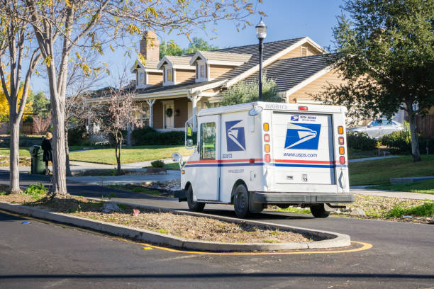 Fullerton, California / USA - July 18, 2020: A USPS (United States Parcel Service) mail truck leaves for a delivery.