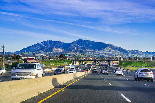 January 28, 2018 Concord / CA / USA - Evening traffic on a highway in San Francisco bay area; Mt Diablo in the background