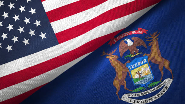 istock Michigan state and United States two flags together realations textile cloth fabric texture 1091538140