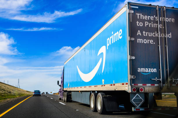 Amazon truck March 19, 2018 Kettleman City / CA / USA - Amazon truck driving on the interstate, the large Prime logo printed on the side amazon.com photos stock pictures, royalty-free photos & images