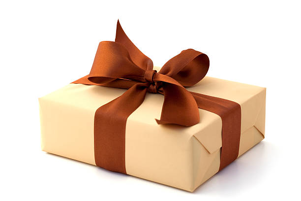 Gift box with brown bow and tan stock photo