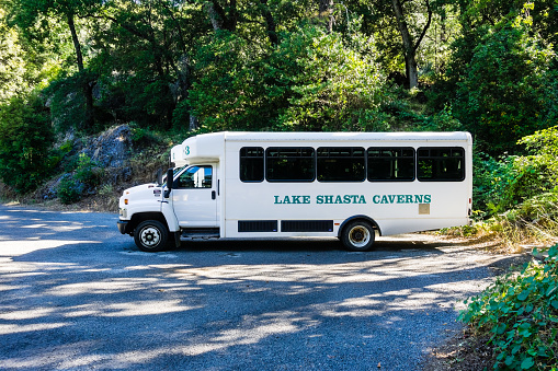June 26, 2018 Lakehead / CA / USA - Lake Shasta Caverns bus waiting to take visitors up to the caves