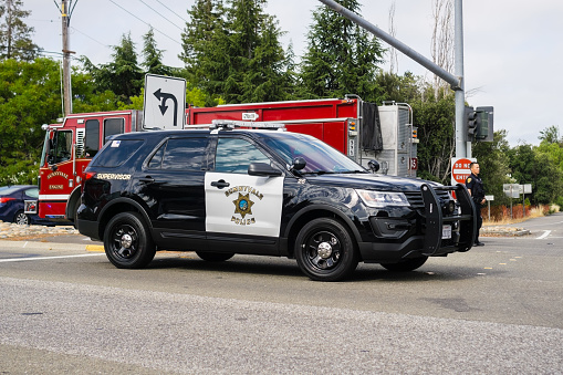 July 13, 2018 Sunnyvale / CA / USA - Police car and Fire Truck stopped at the scene of an accident in south San Francisco bay area