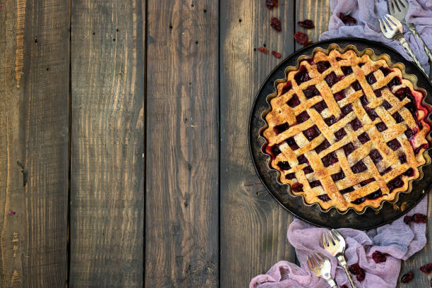 istock Traditional American cherry pie on a dark wooden background 1091547224
