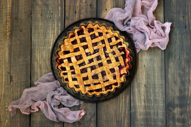 istock Traditional American cherry pie on a dark wooden background 1091547228
