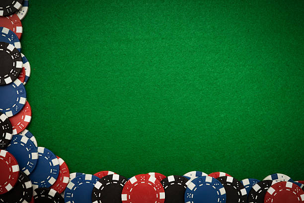 Gambling chips on green felt stock photo